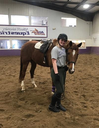 Jessica TenBrink with a horse at the Equestrian Center