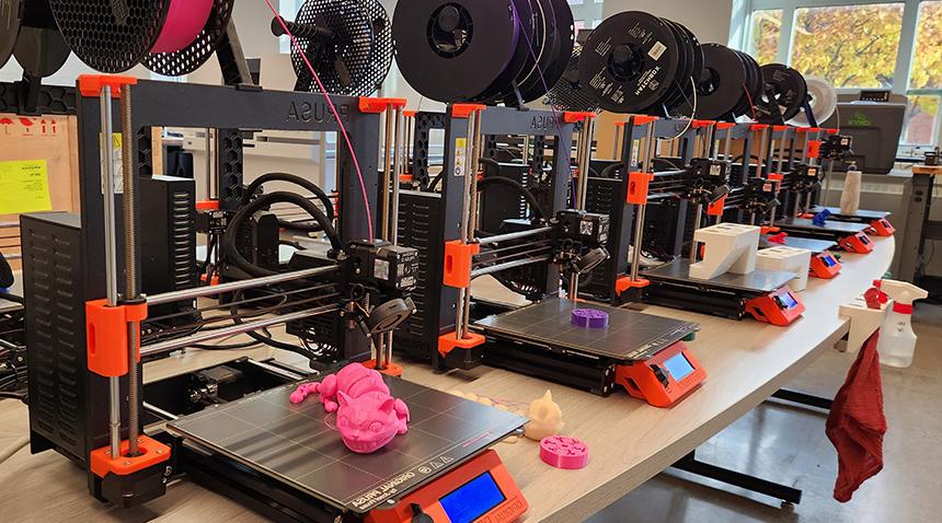 toys in fun colors sitting on 3d printers