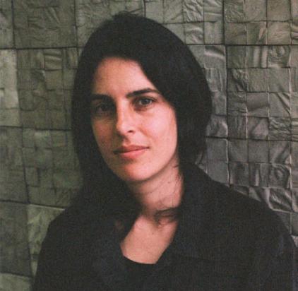 headshot of woman with long dark hair